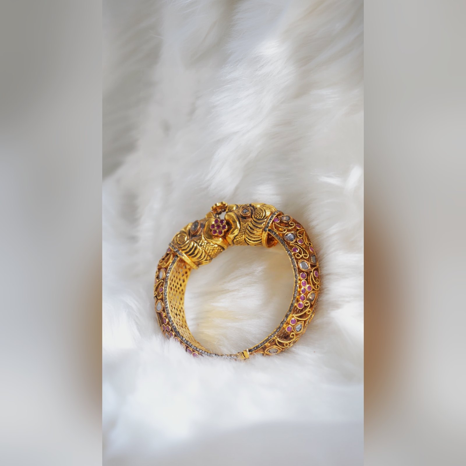 Antique gold kada with peacock motif, ruby and polki by Sri Sai Krishna Jewellers