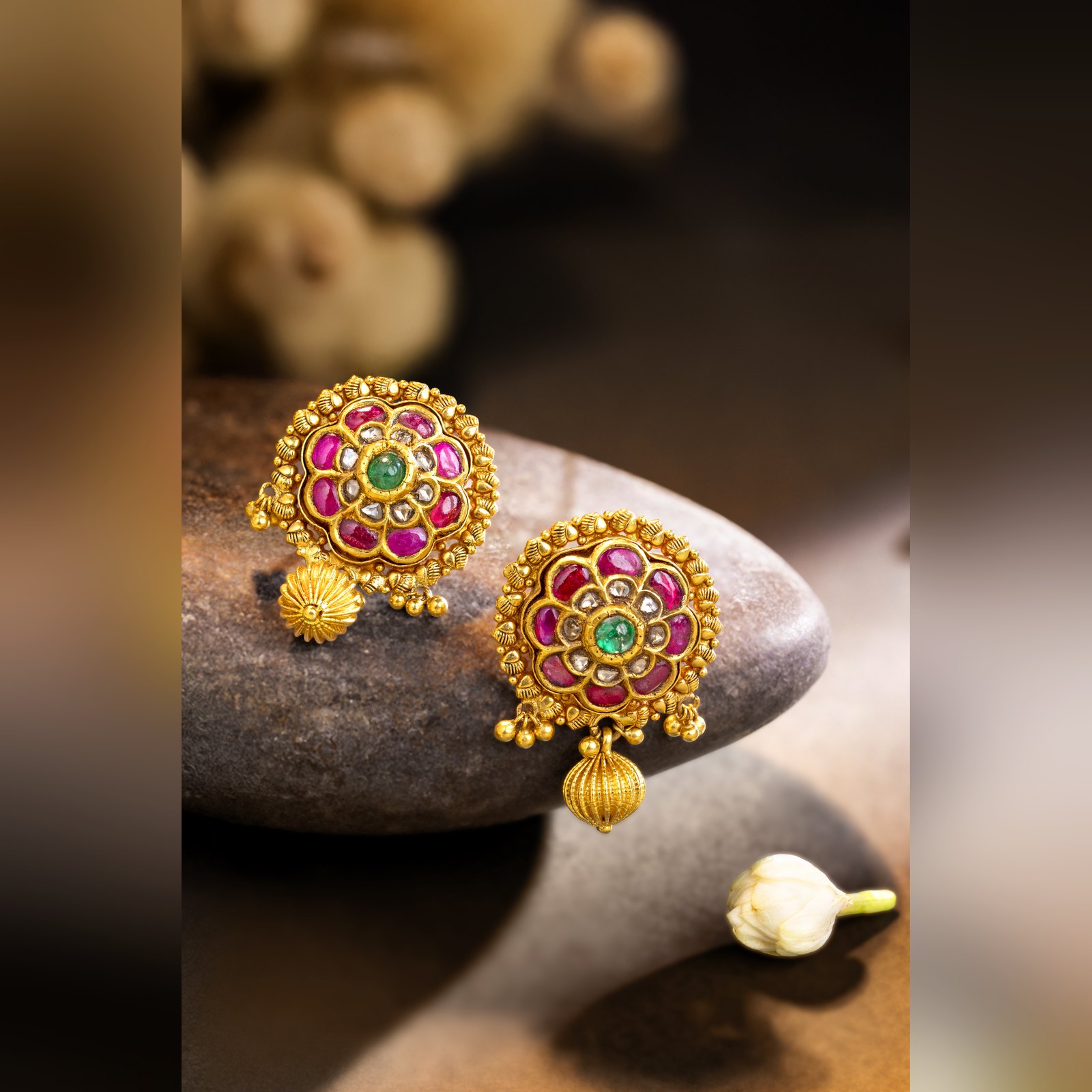 Antique gold ruby floral stud earrings with gold drop by Sri Sai Krishna Jewellers