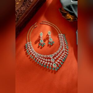 Emerald and diamond bridal necklace set with matching earrings, by Sri Sai Krishna Jewellers