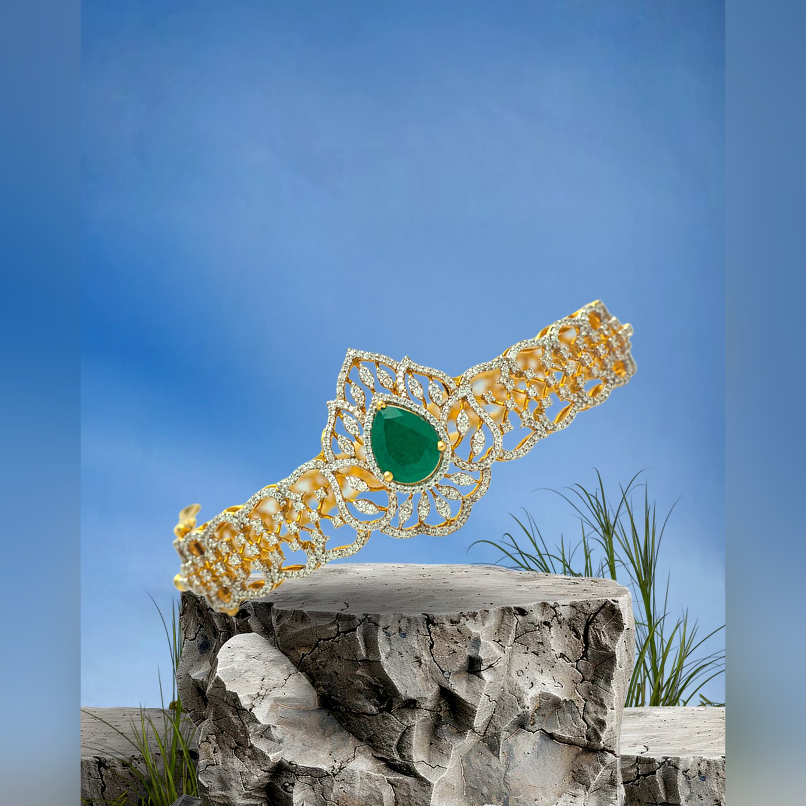 Broad diamond bangle with pear cut emerald centre by Sri Sai Krishna Jewellers