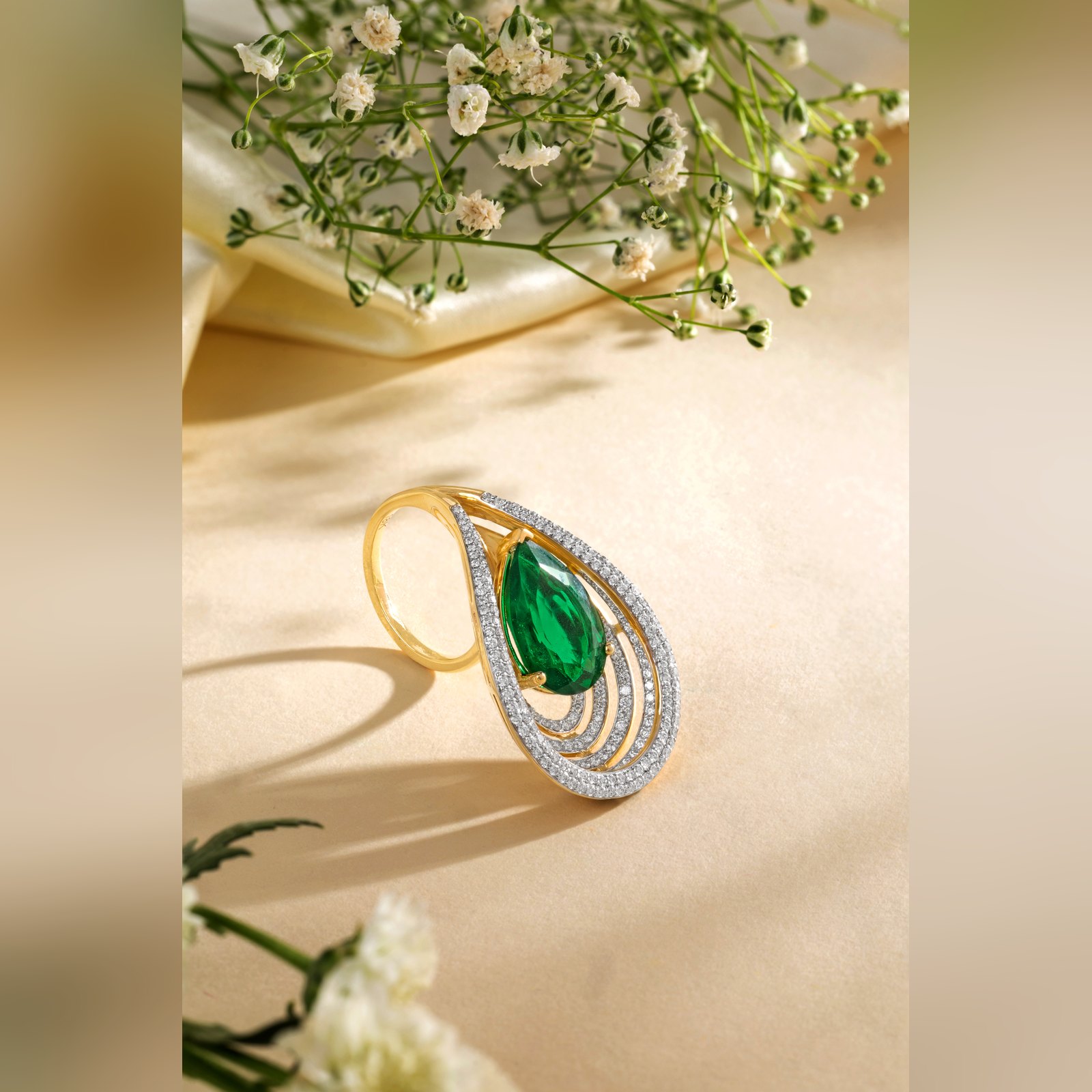 Pear cut emerald and diamond cocktail ring by Sri Sai Krishna Jewellers