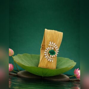 Gold mesh bracelet with emerald floral motif by Sri Sai Krishna Jewellers