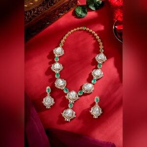 Polki and emerald necklace set with matching earrings, by Sri Sai Krishna Jewellers