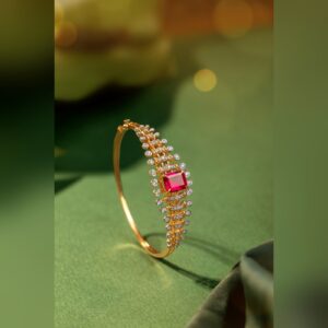 Gold bangle with ruby centre and diamond work by Sri Sai Krishna Jewellers