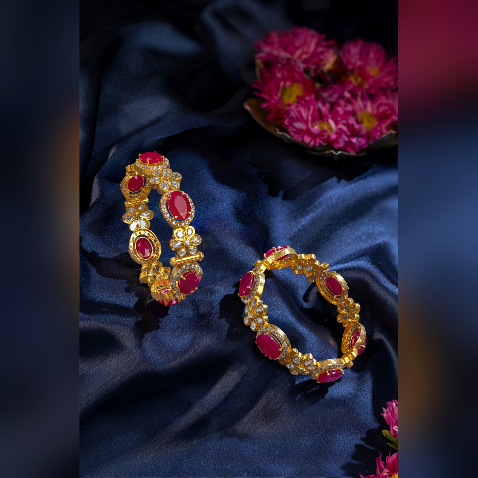 Pair of gold bangles set with rubies and polki by Sri Sai Krishna Jewellers